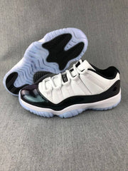 Jordan 11 Low Sneakers in White and Black