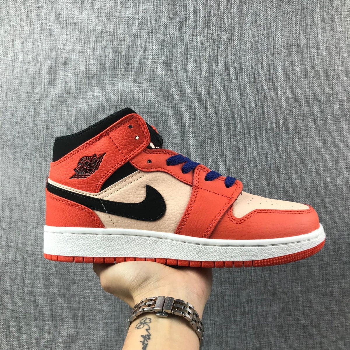 Jordan Air Jordan 1 Mid GS Sneakers in Pink and Orange