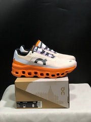 On Cloudmonster Running Shoes in Yellow Tan and Orange