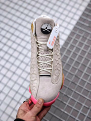 Air Jordan 13 CNY Sneakers in White, Gold and Pink