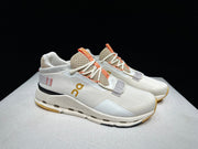 On Cloudnova 2 Sneakers in Ivory and Orange