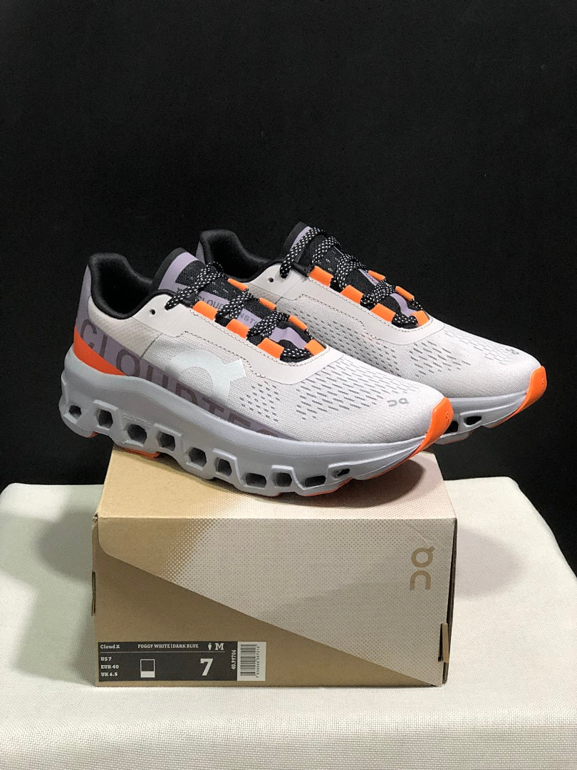 On Cloudmonster Sneakers in Foggy White and Orange