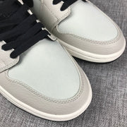 Air Jordan 1 Mid Grey and Black High-Top Sneakers