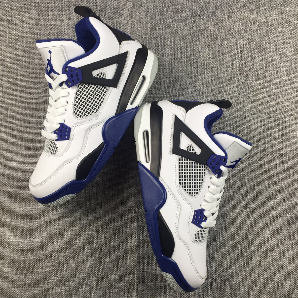 Jordan Air Jordan 4 Sneakers in White, Black and Blue
