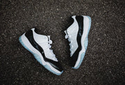 Air Jordan 11 Iridescent Sneakers in White and Black