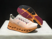 On Cloudsurfer Max Running Shoes in Pearl and Tangerine