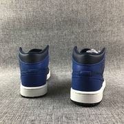Air Jordan 1 Mid Black and Royal Blue High-Top Sneakers