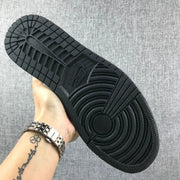 Air Jordan 1 Mid White and Black Sneakers