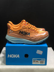 HOKA Stinson 7 Trail Running Shoes in Orange