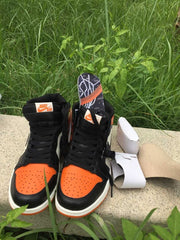 Jordan 1 High Sneakers in Black, White and Orange