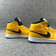 Air Jordan 1 Mid University Gold Black White Sneakers