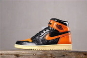 Air Jordan 1 Retro High OG Black and Orange Sneakers