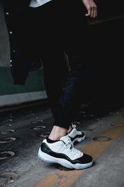 Air Jordan 11 Iridescent Sneakers in White and Black
