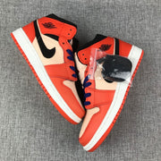 Jordan Air Jordan 1 Mid GS Sneakers in Pink and Orange
