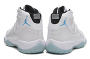Jordan Air Jordan 11 Retro High-Top Sneakers in White and Blue