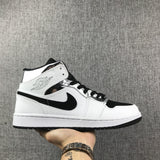 Air Jordan 1 Mid White and Black Sneakers