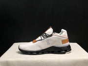 On Cloudnova Sneakers in White, Black and Tan