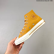 Converse Chuck 70 High Top Sneakers in Mustard
