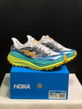 HOKA Stinson 7 Trail Sneakers in Blue and Lime