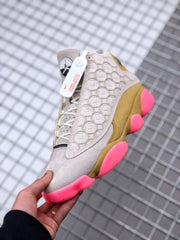 Air Jordan 13 CNY Sneakers in White, Gold and Pink