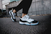 Air Jordan 11 Iridescent Sneakers in White and Black