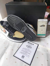 Jordan 1 Low Gold Toe Black and Metallic Gold Sneakers